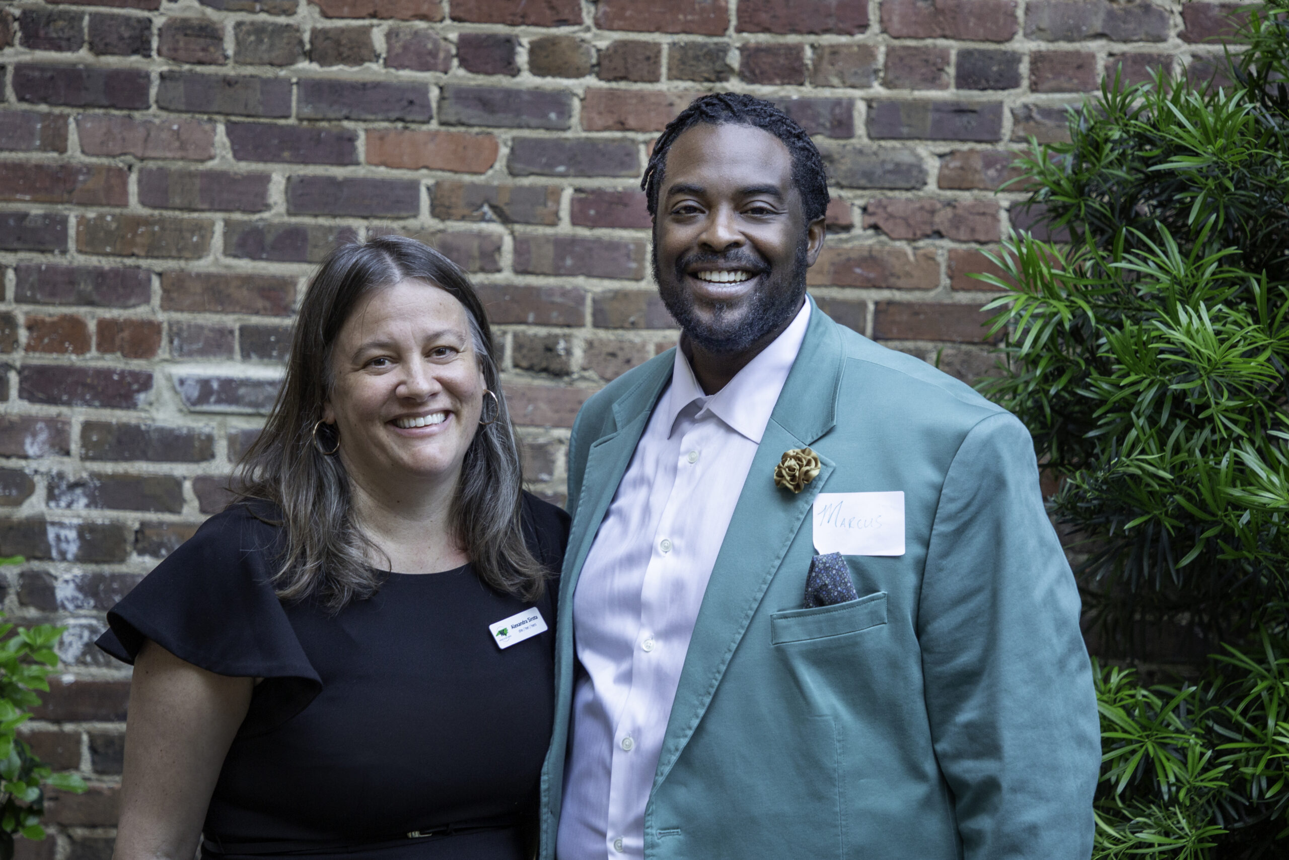 Alexandra Sirota and Marcus Bass pose together at the Budget & Tax Center's first anniversary party.