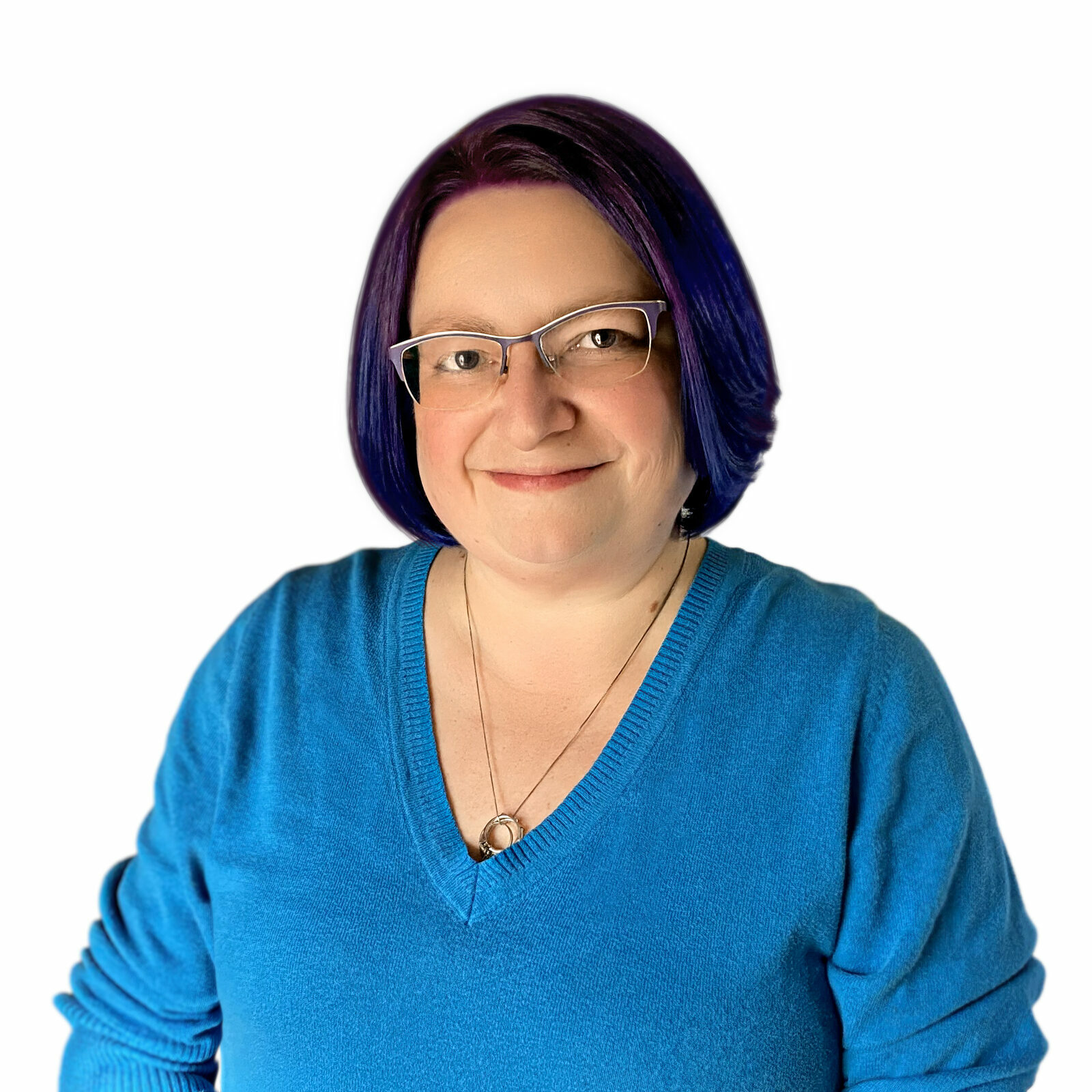 Headshot of Mel Umbarger. The photo is a white woman in her 40s, with purple hair and a blue sweater. She is wearing glasses and smiling.